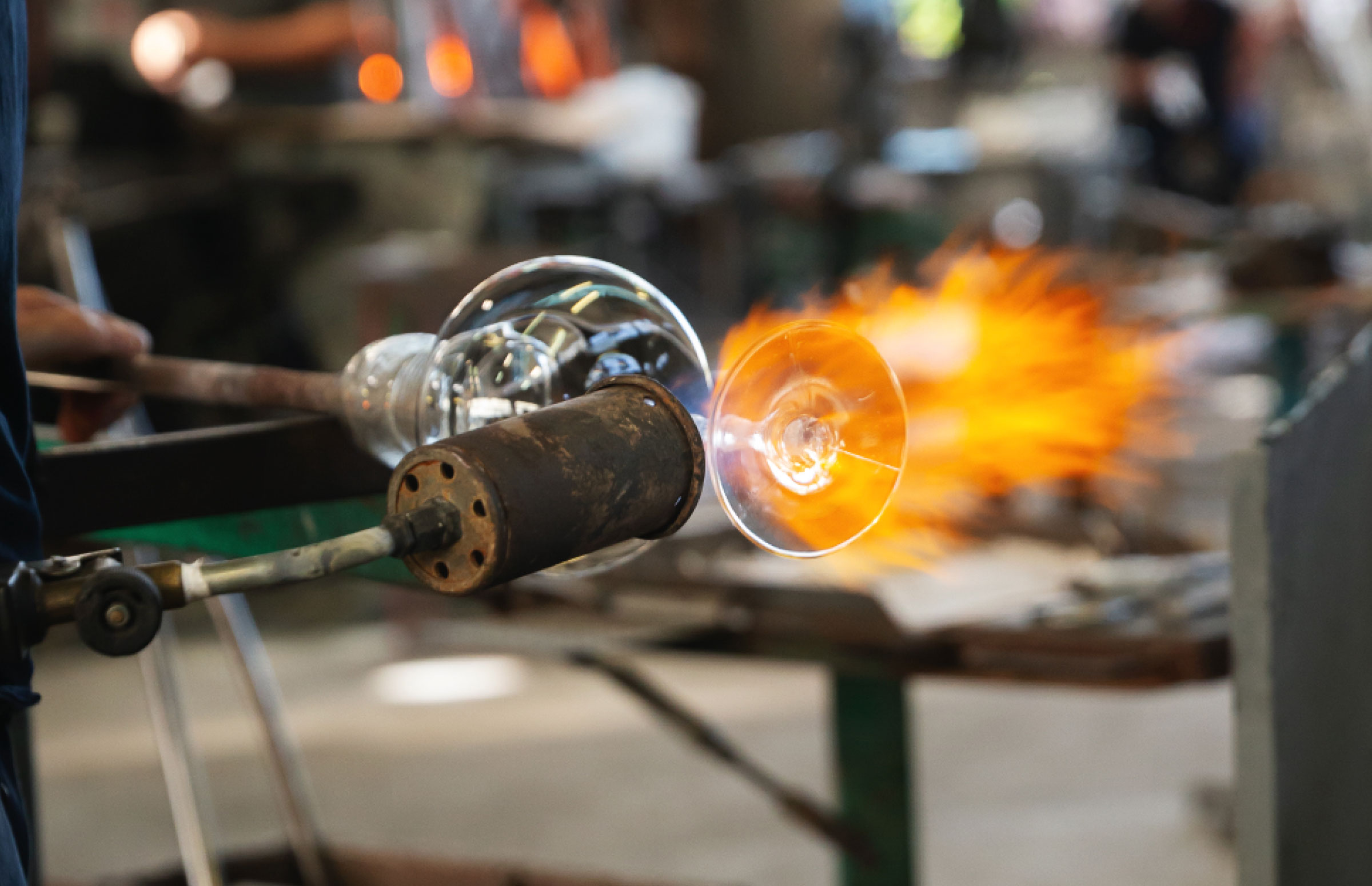 Flame detailing the glass edge during finishing